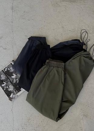 Штани прямі карго палаццо вільні оверсайз з розрізами кнопки застібки полоски висока посадка спортивні кюлоти6 фото