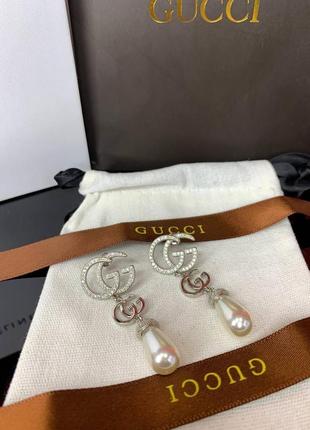 Срібні брендові сережки з цирконами та перлами майоражу, є логотип, люкс якість!7 фото