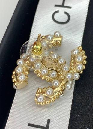 Брендові сережки гвоздик із логотипом позолоту перлів циркій7 фото