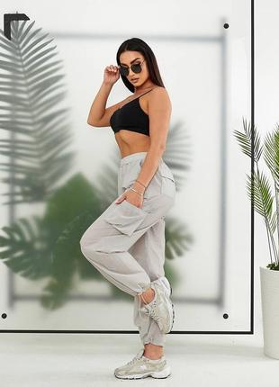 Женские брюки карго внизу фиксаторы сбоку карманы