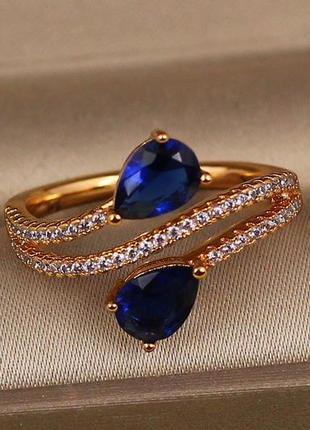 Кільце xuping jewelry зустрічні краплі із синіми каменями р 20 золотисте
