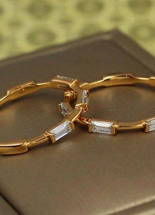 Кольцо xuping jewelry сальто с прямоугольными камнями по кругу р 19  золотистое3 фото