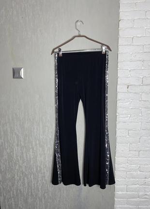 Трикотажные брюки клеш расклешенные брюки с серебристыми лампасами menny rose, xl4 фото