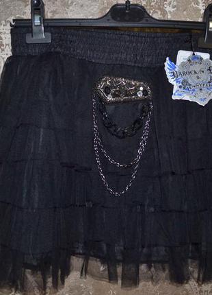 Мини - юбка   новая  чёрная с оборками1 фото