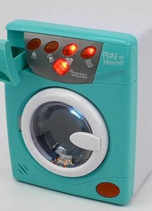 Игрушка стиральная машинка с крутящимся барабаном световые и звуковые эффекты наляля5 фото