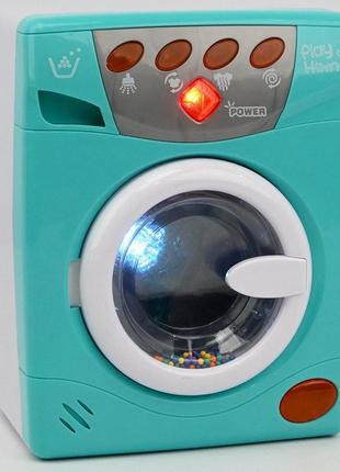 Игрушка стиральная машинка с крутящимся барабаном световые и звуковые эффекты наляля3 фото