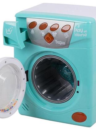 Игрушка стиральная машинка с крутящимся барабаном световые и звуковые эффекты наляля2 фото