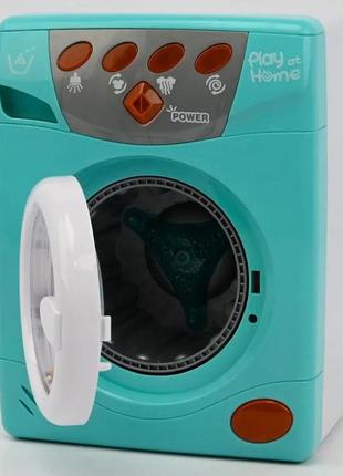Игрушка стиральная машинка с крутящимся барабаном световые и звуковые эффекты наляля6 фото