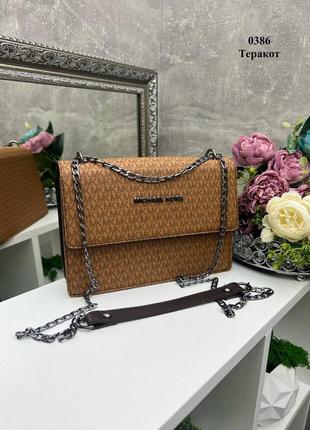 Оранжевый женский каркасный клатч michael kors