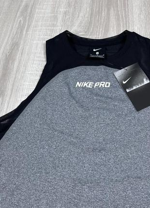 Женский оригинальный спортивный топ nike pro4 фото