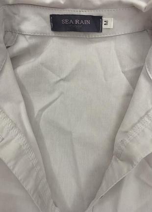 Блуза белая свободного кроя с длинным рукавом.2 фото
