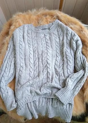 Сіра кофта з косами