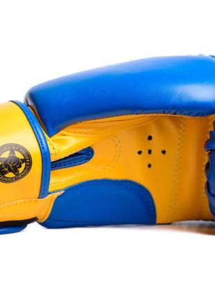 Боксерські рукавиці powerplay 3004 jr classic синьо-жовті 8 унцій3 фото