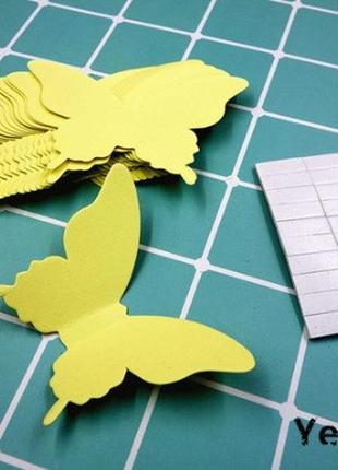 Декор для стін метелики жовтий - у наборі 20 штук розміром 8*5см, картон, є 2-х сторонній скотч