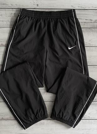 Стильні нейлонові штани на манжетах nike оригінал
