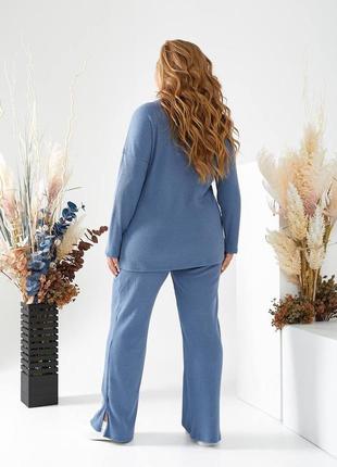 Костюм жіночий оверсайз асиметрична кофта штани вільного крою на високій посадці з кишенями теплий блакитний чорний3 фото