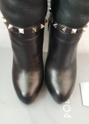 Стильные кожаные сапоги на высоких каблуках черного цвета2 фото