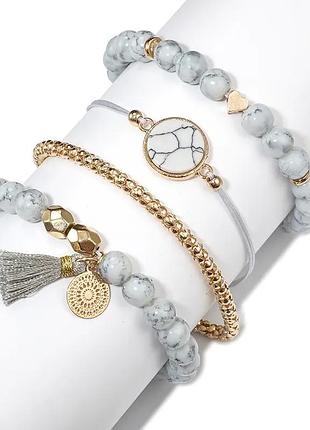 Браслети жіночі стильний набір 4 шт. каміння біло сірого кольору метал золотистий із декором