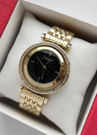 Золотистые наручные часы для девушек с черным циферблатом вращающимся и камушками вокруг