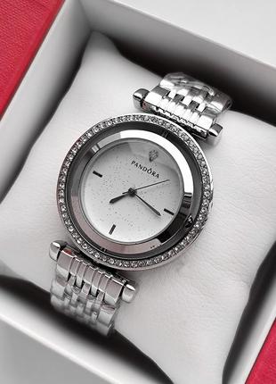 Серебряные наручные часы для девушек с циферблатом вращающимся и камушками вокруг