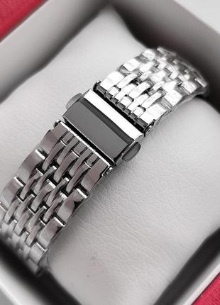 Серебряные наручные часы для девушек с циферблатом вращающимся и камушками вокруг4 фото