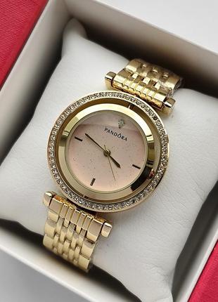 Золотистые наручные часы для девушек с розовым циферблатом вращающимся и камушками вокруг