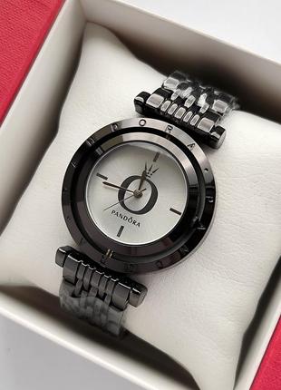 Женские наручные часы черного цвета с вращающимся и камушками вокруг1 фото