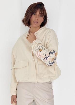 Жіноча куртка бомпер з вишитими рукавами6 фото