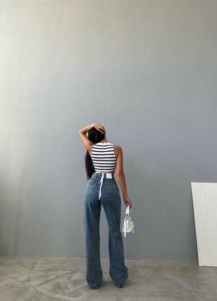 Стильные джинсы с высокой посадкой прямого свободного кроя клеш широкие модные трендовые4 фото