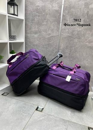 Яскрава ефектна дорожня сумка на колесах з подвійним дном 2 розміри4 фото