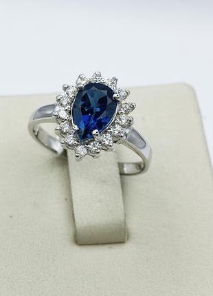 Кольцо серебряное с лондон топазом и кубическим цирконием 18 2,62 г
