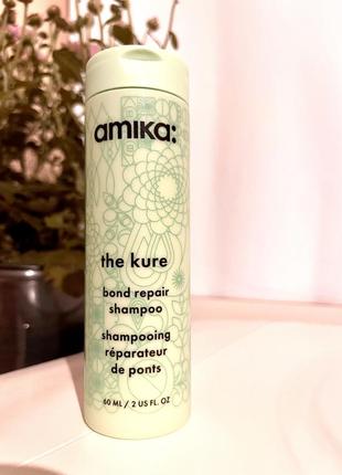 Відновлюючий шампунь для пошкодженого волосся amika the kure bond repair shampoo1 фото