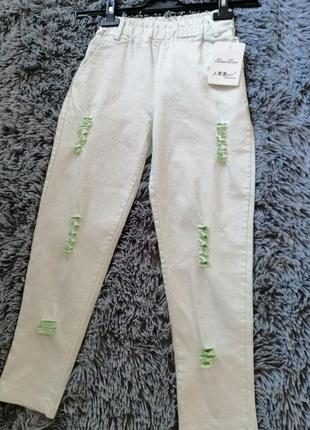 Укорочені рвані джинси джеггінси з яскраво-зеленим виворотом  укороченные рваные джинсы джеггинсы с2 фото