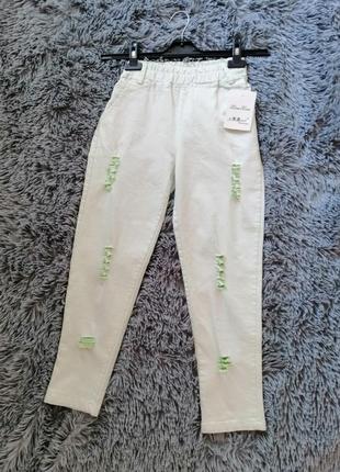 Укорочені рвані джинси джеггінси з яскраво-зеленим виворотом  укороченные рваные джинсы джеггинсы с3 фото