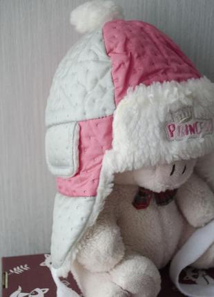 Милая зимняя шапка-ушанка с заворотом и пумпоном2 фото