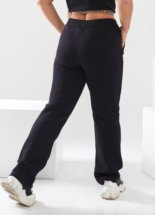 Жіночі теплі прямі трикотажні брюки спортивного стилю з карманами2 фото