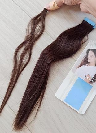 Натуральные волосы на липкой ленте.