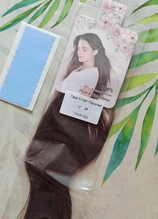 Натуральные волосы на липкой ленте.