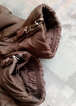 Довге пухове пальто з капюшоном
benetton коричнева стьобана куртка на пуху5 фото