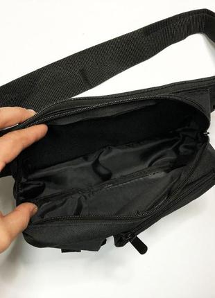 Качественная и надежная тактическая сумка-бананка из прочной и водонепроницаемой ткани черная через плечо8 фото