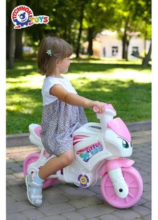 Детский мотоцикл толокар каталка бело розового цвета для девочки7 фото