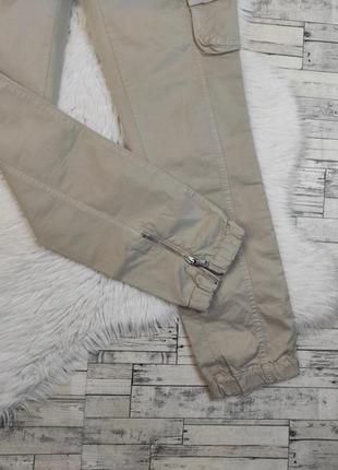 Женские брюки benetton бежевого цвета с накладными карманами размер 48 l3 фото