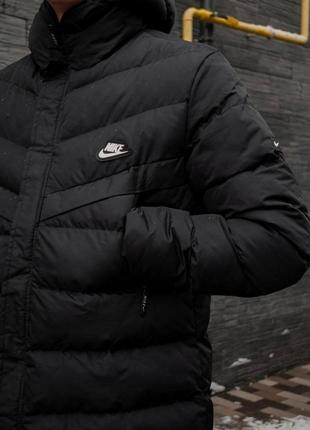 Зимняя тёплая куртка nike пуховик уделённый найк чорний подовжений пуховик nike3 фото