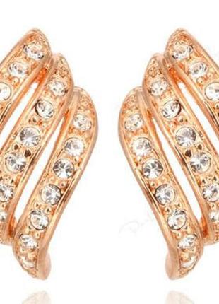 Жіночі сережки золотистого кольору із кристалами