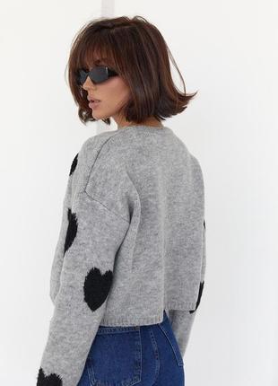 Жіночий в'язаний светр оверсайз з сердечками.3 фото