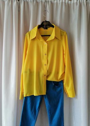 Красива яскрава жовта блуза сорочка розмір на бирці вказаний 44 ширина плечей 35 см напівобхват груд2 фото