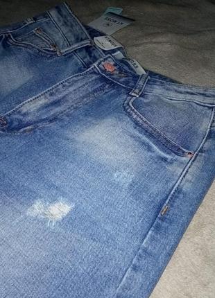 Женские светлые рваные джинсы 284 фото