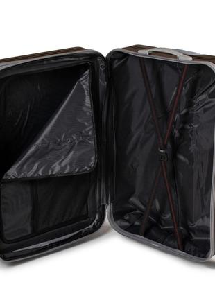 Дорожный пластиковый чемодан черного цвета4 фото