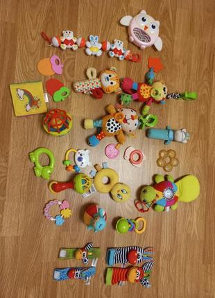 Іграшки погремушки пищалки шуршалки