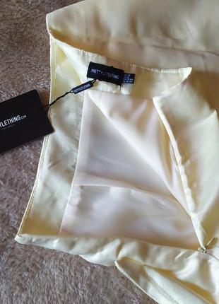 Эффектная праздничная качественная сатиновая кремовая юбка с бантом и разорхом на ножке7 фото